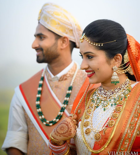 Bride in Flat Diamond Choker jhumkas Kasu Mala