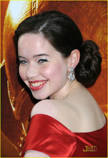 Anna Popplewell in shiny red dress