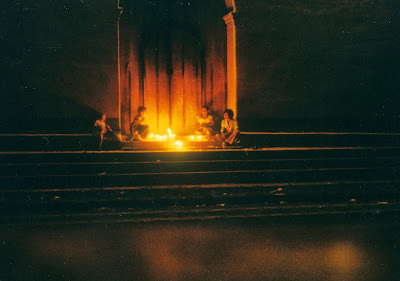 Children with candles on church steps for All Saints Day or Dia de los Santos in Sociedad, El Salvador