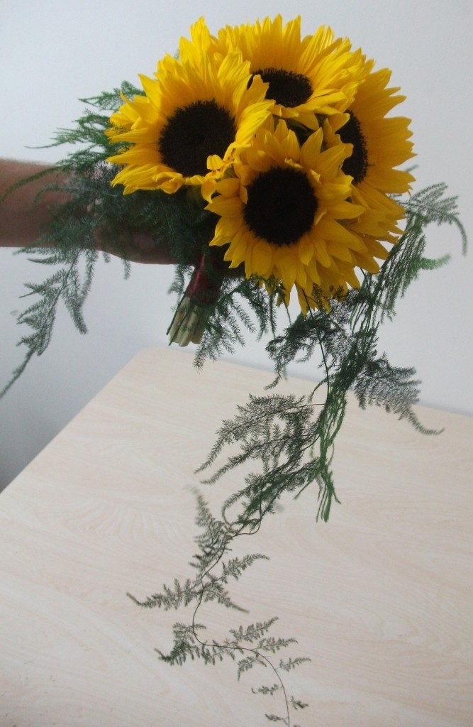 The finished bridal bouquet of sun flowers can be made the day prior to your