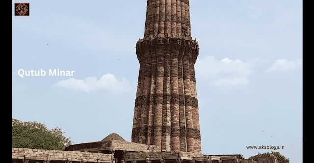 A tall sandstone tower adorned with intricate carvings.