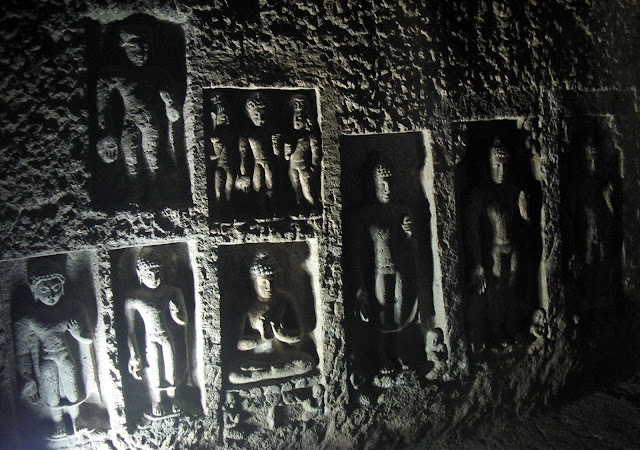 Buddha figure carved in stone fresco