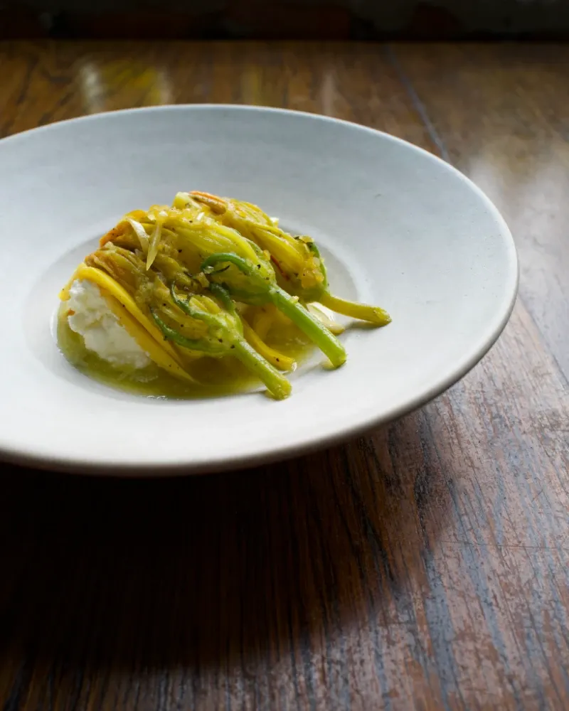 Braised zucchini flowers, house ricotta, saffron _ salted meyer lemon