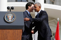 U.S. President Barack Obama (R) shakes hands with Canadian Prime Minister Justin Trudeau (L) during the arrival ceremony at the White House in Washington March 10, 2016. (Credit: Reuters) Click to Enlarge.