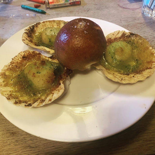 Three big scallops, served in their shells with a savoury brioche roll