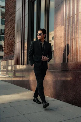 A Fashionable Man Wearing Black Suits and Leather Shoes