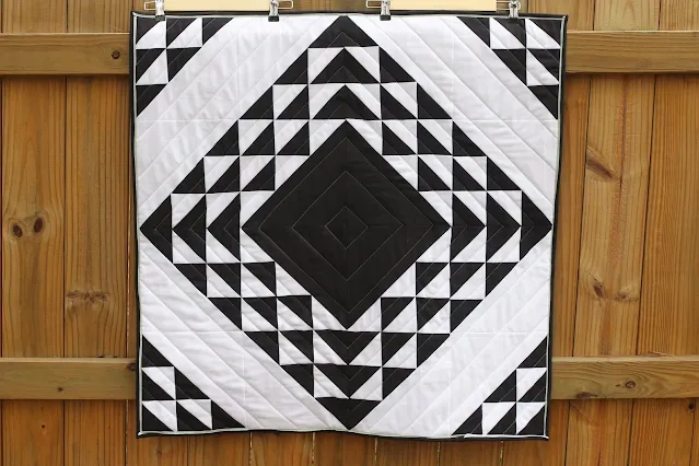 black and white vertigo baby quilt