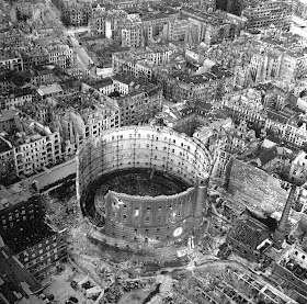 Excellent aerial view showing devastation and bombed out buildings over wide area.
