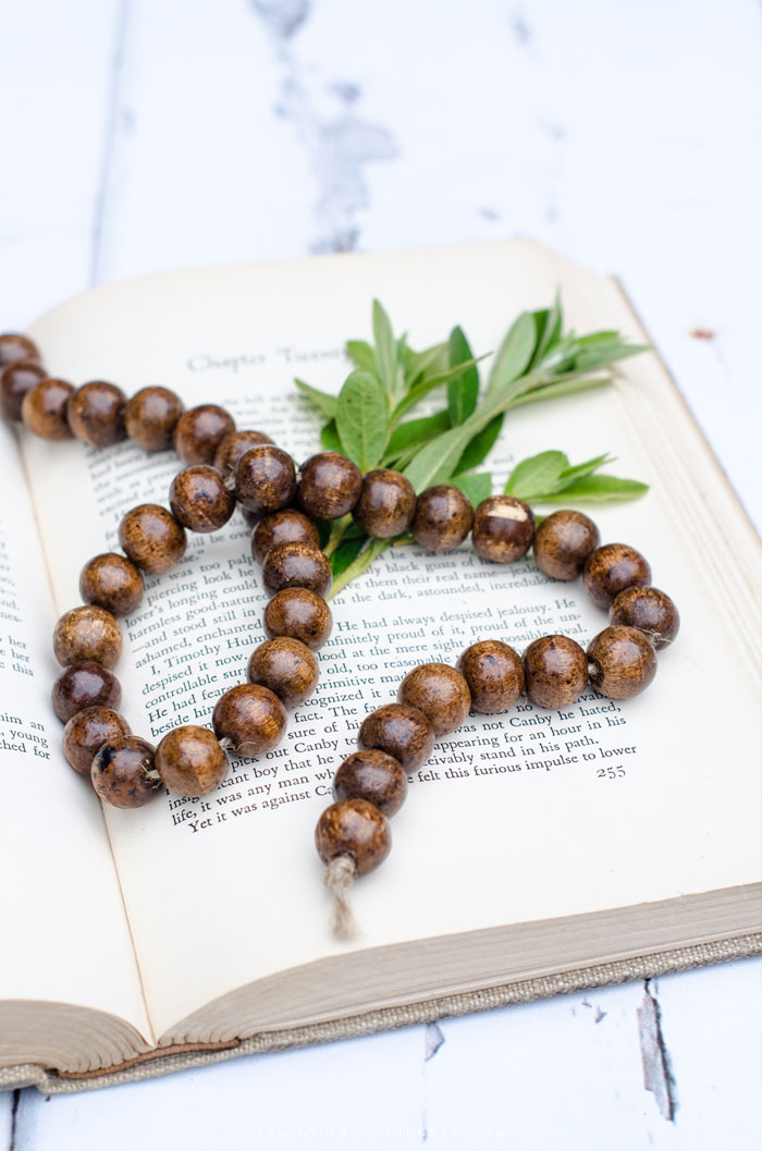 Wood bead garland on vintage book