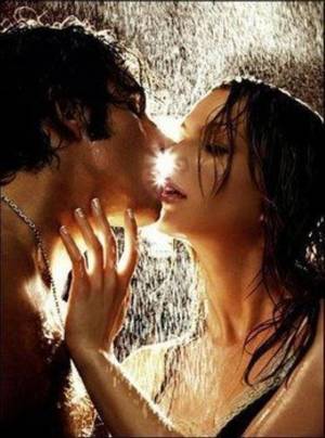 a couple kissing in the rain. Love