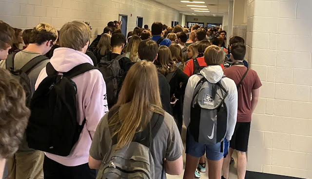 In this now-infamous photo, 15-year-old Hannah Waters captured a crowded hallway at North Paulding High School in Georgia, where no one was social distancing and almost no one was wearing masks.