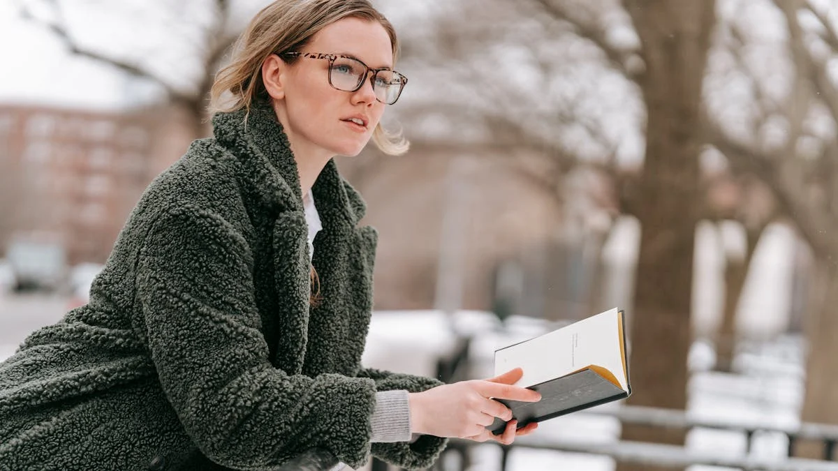 Young Thoughtful woman with Open Book on Winter Street