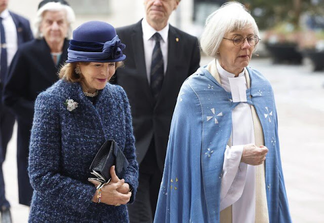 Queen Silvia wore a blue tweed coat and a blue tweed dress by Chanel. Georg et Arend dress. Archbishop Martin Modeus