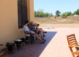 Sat on the balcony having a chat while the BBQ sizzles