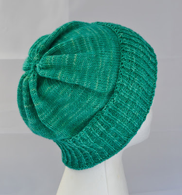 a green slouchy hat for sale at https://www.etsy.com/shop/JeannieGrayKnits