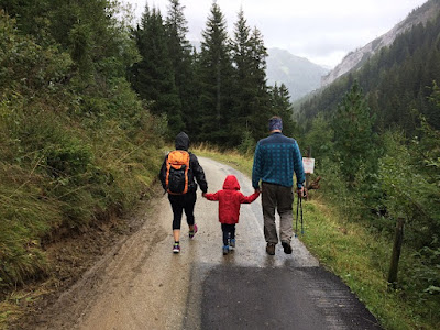 Family walking along forest path