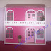 Casa rosa em miniatura