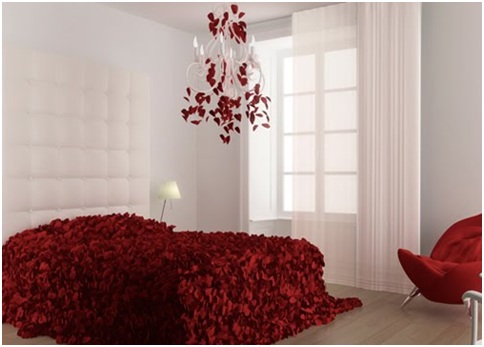 White bedroom with bedspread made of red rose petals