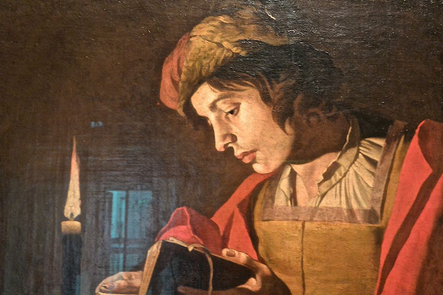 Stockholm: national museum : Matthias Stom (1600_1650) A young man reading by candlelight