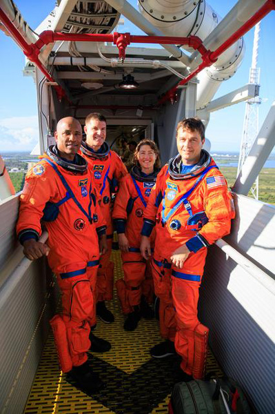 The Artemis 2 astronauts pose inside the crew access arm of the Space Launch System's (SLS) mobile launcher at NASA's Kennedy Space Center in Florida...on September 20, 2023.