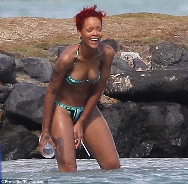 Rihanna already has over a dozen tattoos over her body this gun tattoo is 