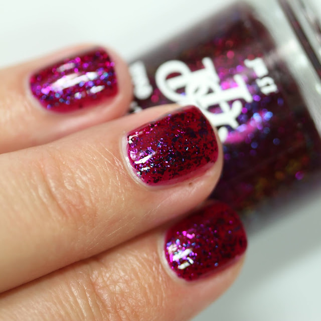 raspberry pink nail polish with multi chrome flakes