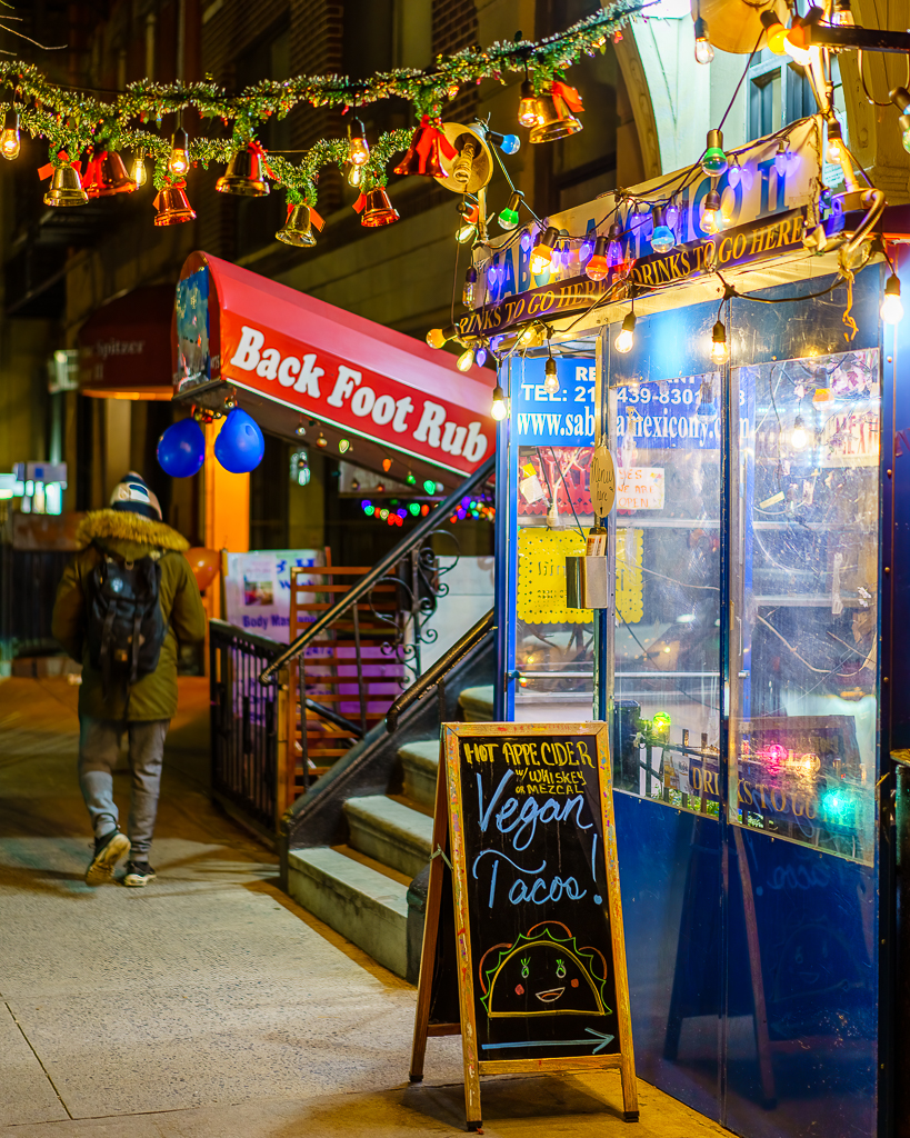 a photo of a vegan taco restaurant beside a massage therapy office