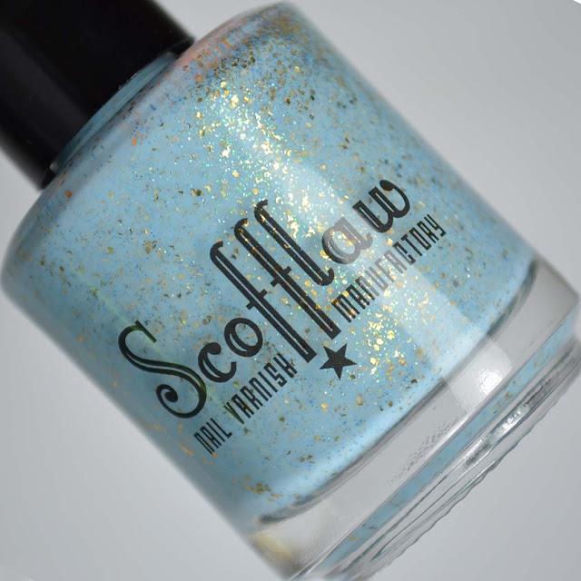 light blue creme with gold flecks in a bottle