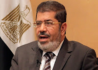 ناشط حقوقي بالمنيا يوجه رسالة للرئيس مرسي ..الإخوان المسلمين جماعة رأسمالية وهو سر تقاربها مع الولايات المتحدة الأمريكية