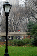 Me in Central Park, April 2009 (central park bridge red umbrellaweb)