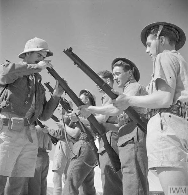 British rifle inspection in North Africa, 25 February 1942, worldwartwo.filminspector.com