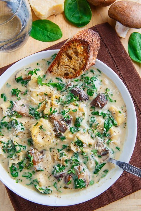 A hearty and tasty bowl of creamy mushroom and spinach soup with tortellini that is pure comfort food; perfect for cold winter days!