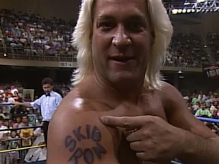 WCW Clash of the Champions XII - Buddy Landell shows off his Skid Row "tattoo"