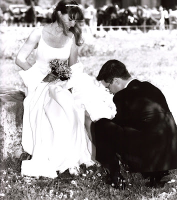 He's taking off my garter but I always thought it looked like Prince 