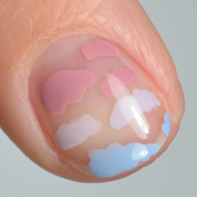 gradient cloud nail art featuring tones of blue and purple