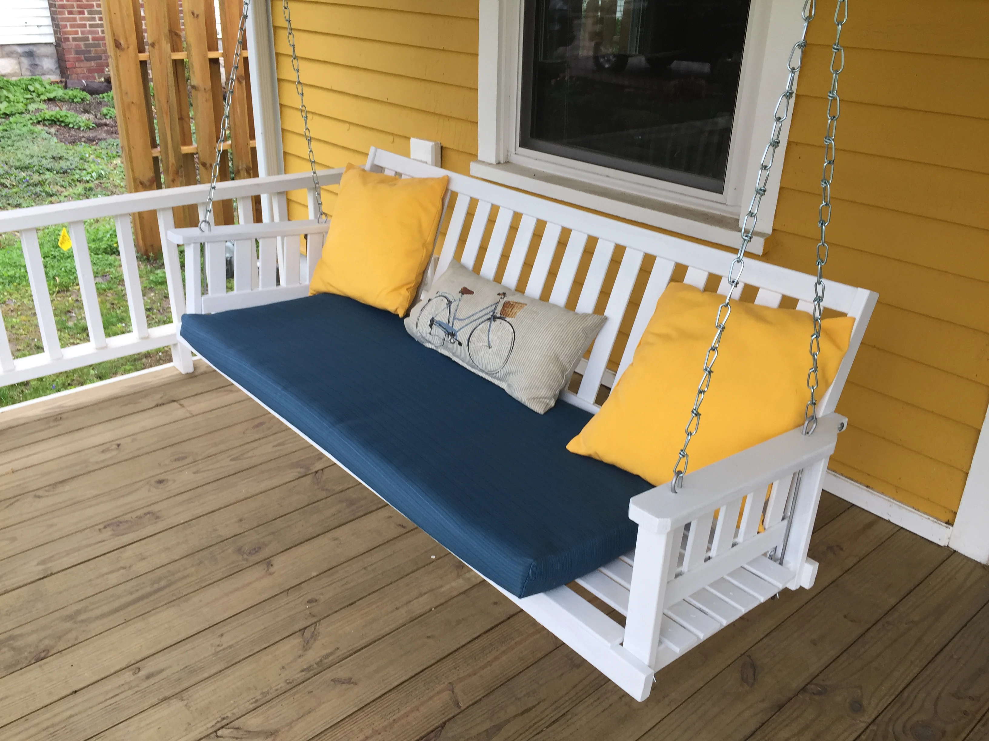 Customized wraparound porch with swing and seating