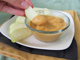 apple dipping in pumpkin yogurt