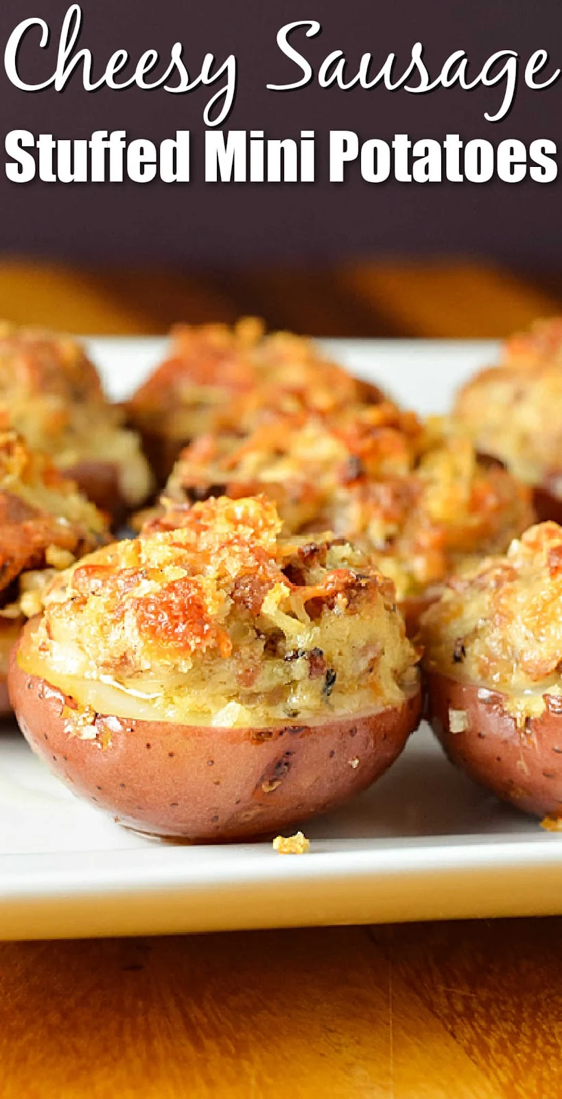 A side shot of Cheesy Sausage Stuffed Mini Potatoes on a white serving tray. White text at the top of photo Cheesy Sausage Stuffed Mini Potatoes.