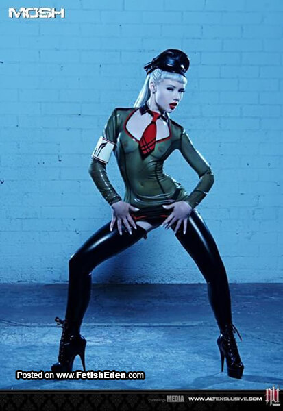 Cop Miss Mosh blonde in green translucent latex top with black latex leggings