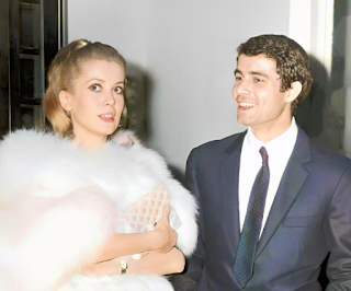 Catherine Deneuve and Nino Castelnuovo arrive at a promotional event for The Umbrellas of Cherbourg