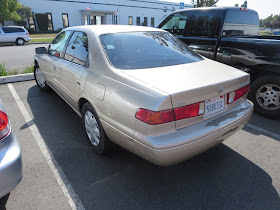 Faded and peeling paint on Toyota Camry.