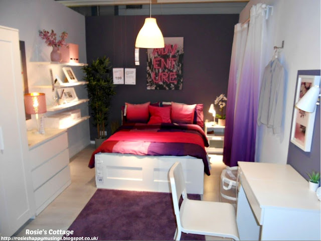 It's Ikea time: Tones of reds pinks and purples make this a perfect bedroom for young professionals or students.