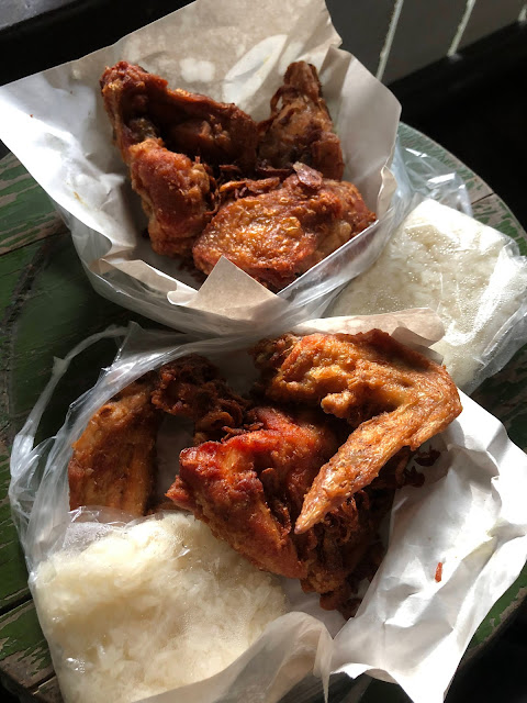 various pieces of Thai fried chicken served with sticky rice in Ayutthaya, Thailand