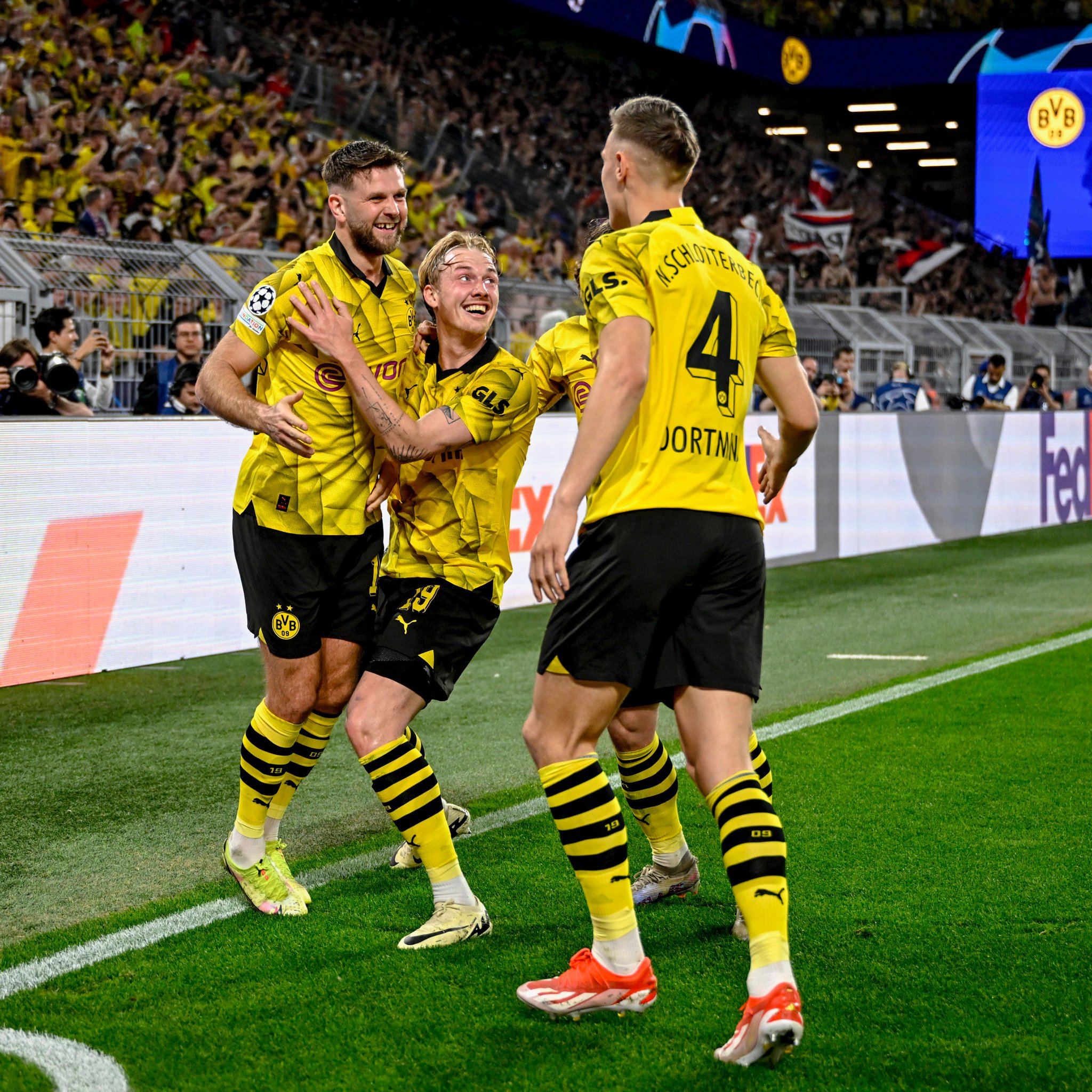 Niclas Fullkrug celebrates goal for Borussia Dortmund with teammates in the Uefa Champions League 2023/24 match against Paris Saint-Germaine (PSG) at Signal Iduna Park on Wednesday 1 May, 2024