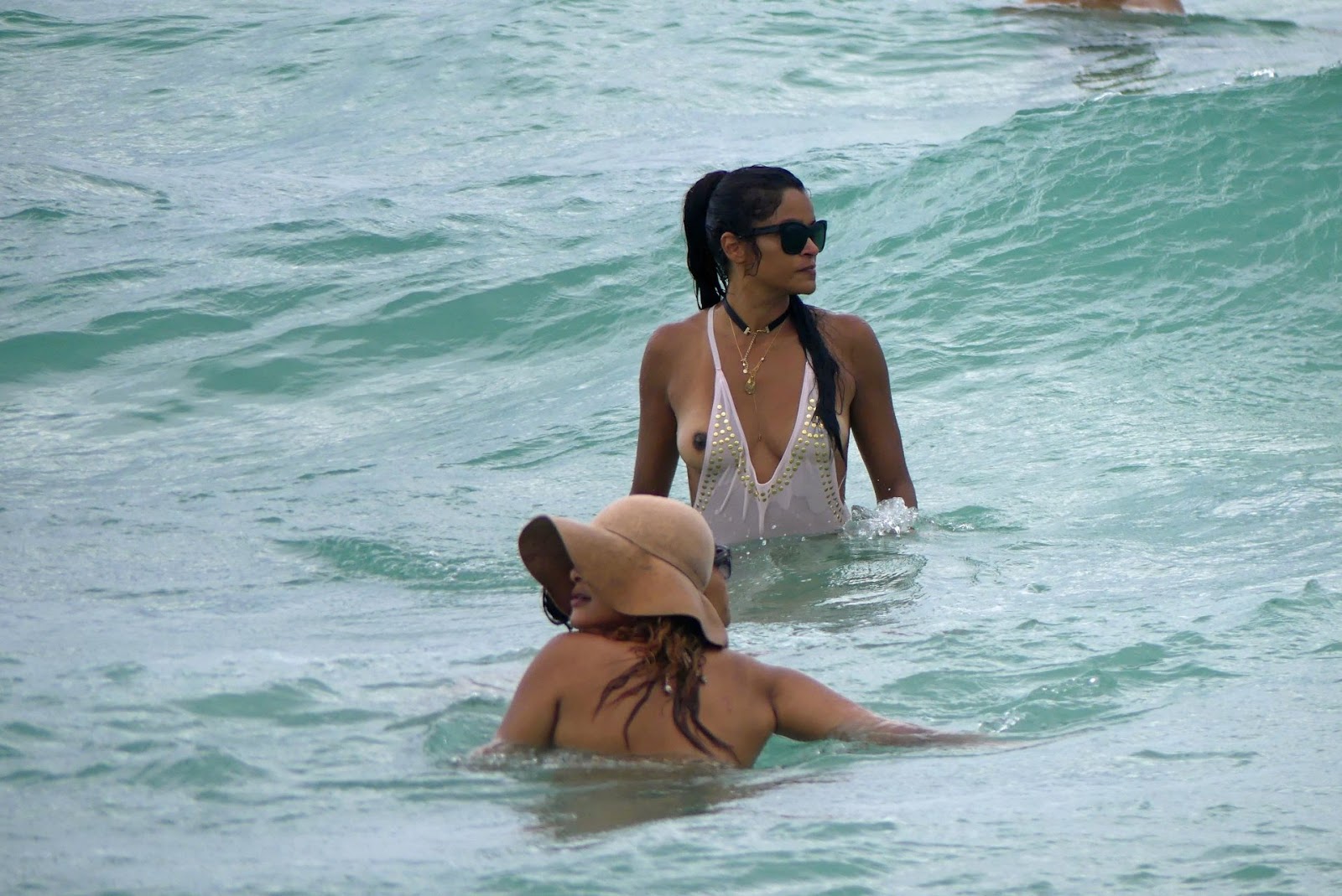 Claudia Jordan swimsuit malfunction, while swimming in the ocean of Miami Beach