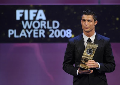 Portuguese football player Cristiano Ronaldo poses with FIFA world footballer of the year 2008 award during a ceremony on January 12, 2009 in Zurich. Ronaldo, who is also holder of the prestigious Ballon d'Or for the European Footballer of the Year, beat off competition from 2007 winner Kaka (Brazil), Lionel Messi (Argentina), Fernando Torres (Spain) and Xavi (Spain).