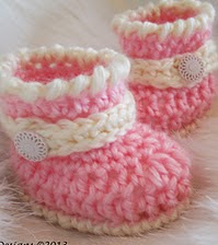 http://www.ravelry.com/patterns/library/cute-baby-boots-crochet-pattern