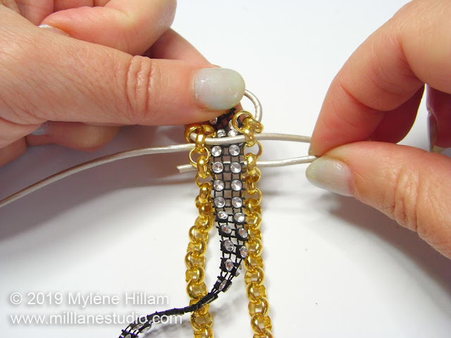 Adding the diamanté braid inbetween the chains.