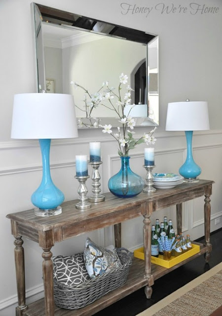 console table vignette blue lamps 