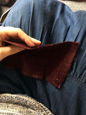 Squares of red fulled wool, stacked one atop the other. The top square's right edge is aligned with the middle of the bottom square; they're pinned along the overlap and shown edge on